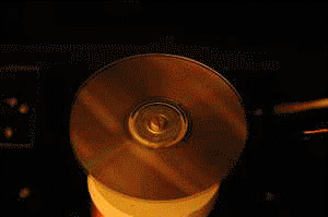 Animated gif of a CD burning with the briefcase Tesla coil.