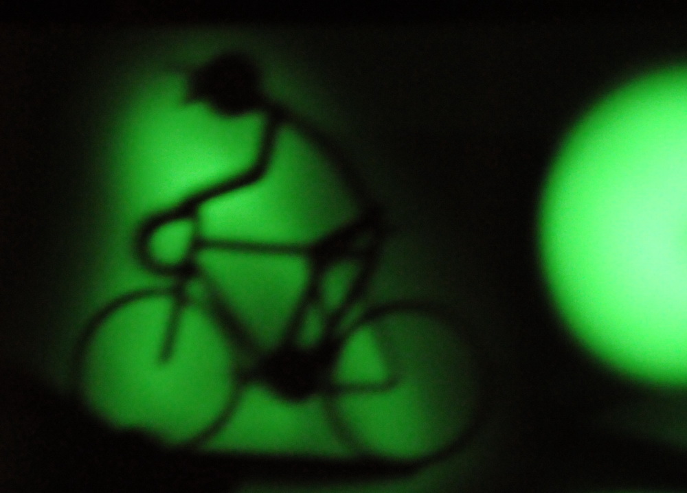 Phoshorescent sheet with shadow of bicycle. Phosphorescence