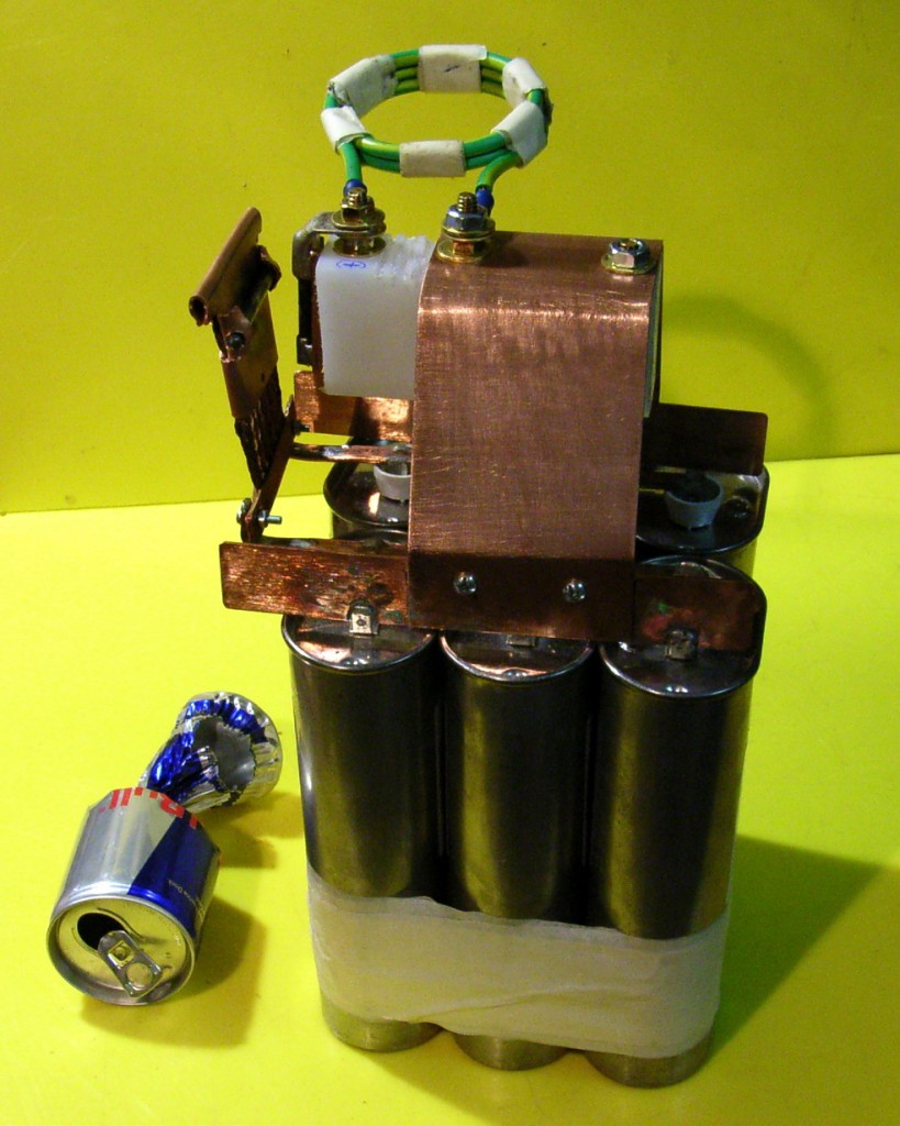 Can crusher 3 and a crushed Red Bull can