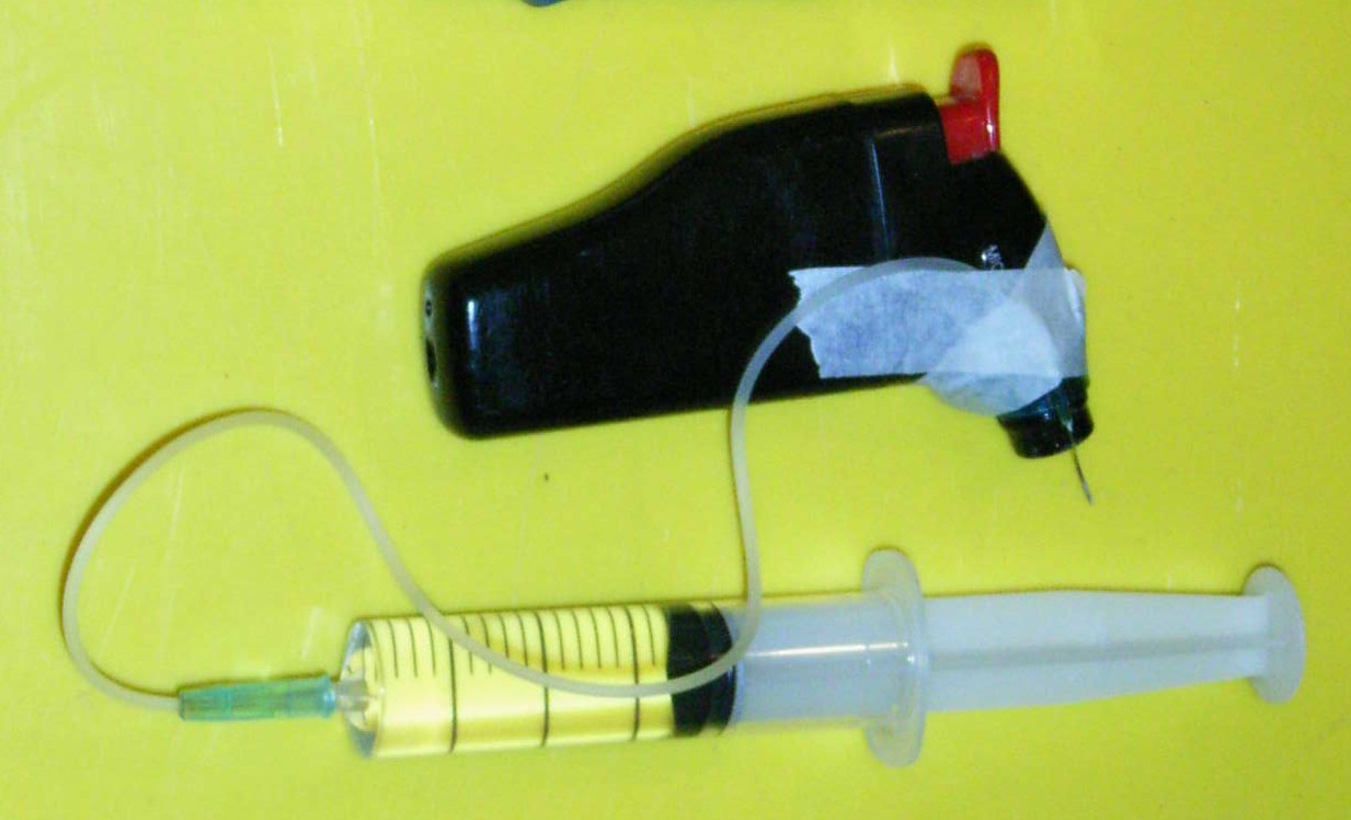 Syringe and ignitor