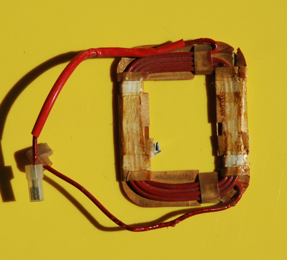The heavy wire from the 6 volt section of the winding is used for the primary coil.
