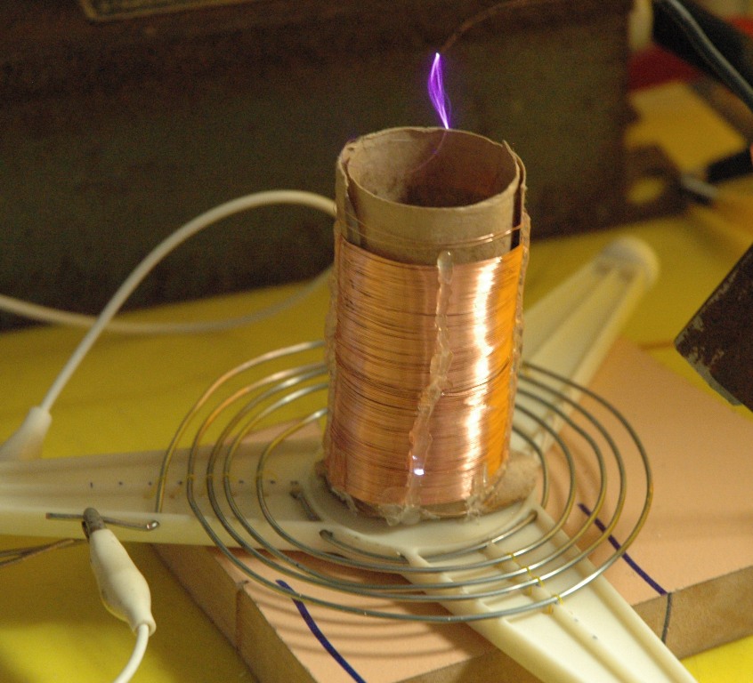 It is possible, but very difficult, to make a high voltage Tesla coil using parts from only 1 microwave oven