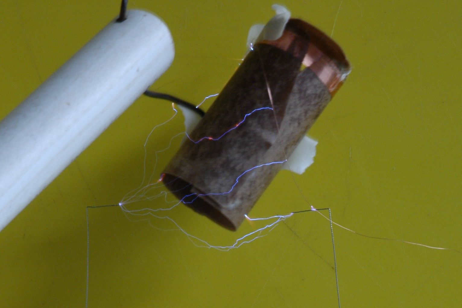 The secondary former is made from cardboard found inside the microwave oven capacitor. 