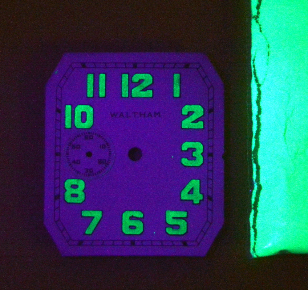 Radioluminescent watch face lit here with UV light. The phosphor no longer is bright enough to see with the Radium.