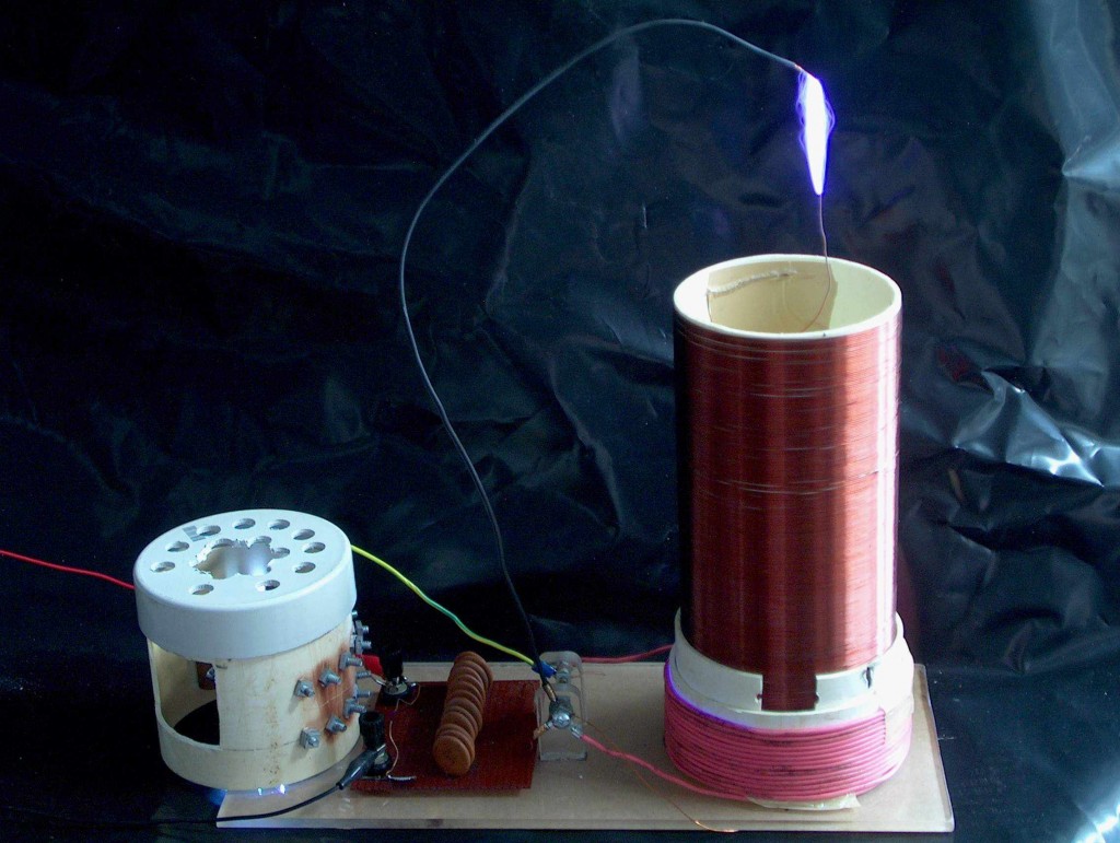 The mini Tesla coil makes high voltage producing 2-3 inch sparks.