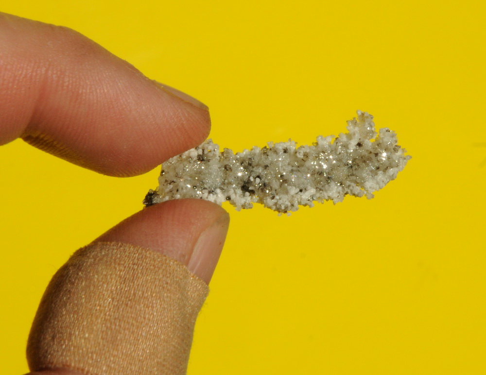 Fused and sintered sand.