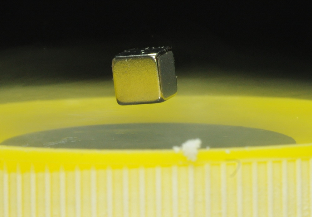 Magnetic levitation above superconductors - Meissner effect.  Jump to the "Superconductor" page.