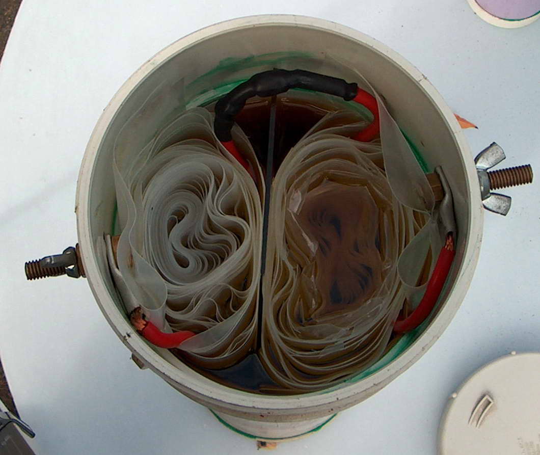 Rolled poly caps in series internally