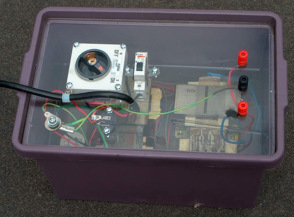 4 inch Tesla coil supply from 4 microwave oven transformers