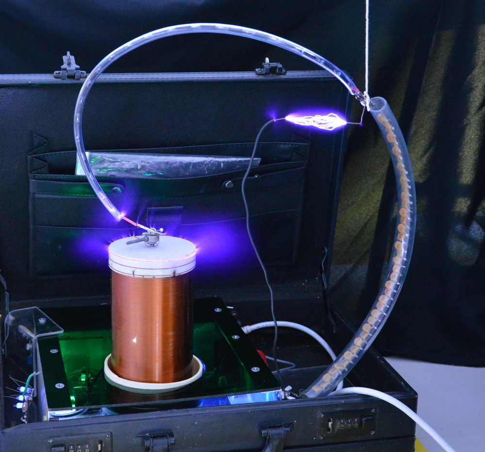 Tesla coil rectification with sparks across the capacitor