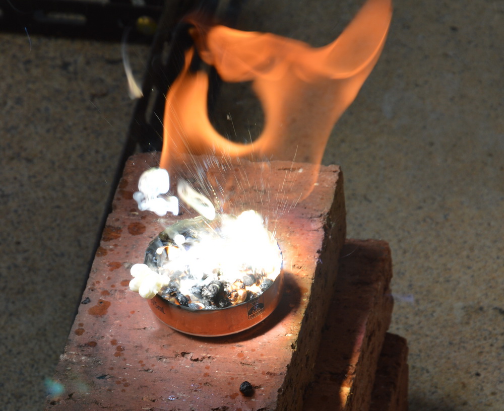 Fresnel lens focuses sunlight to make popcorn