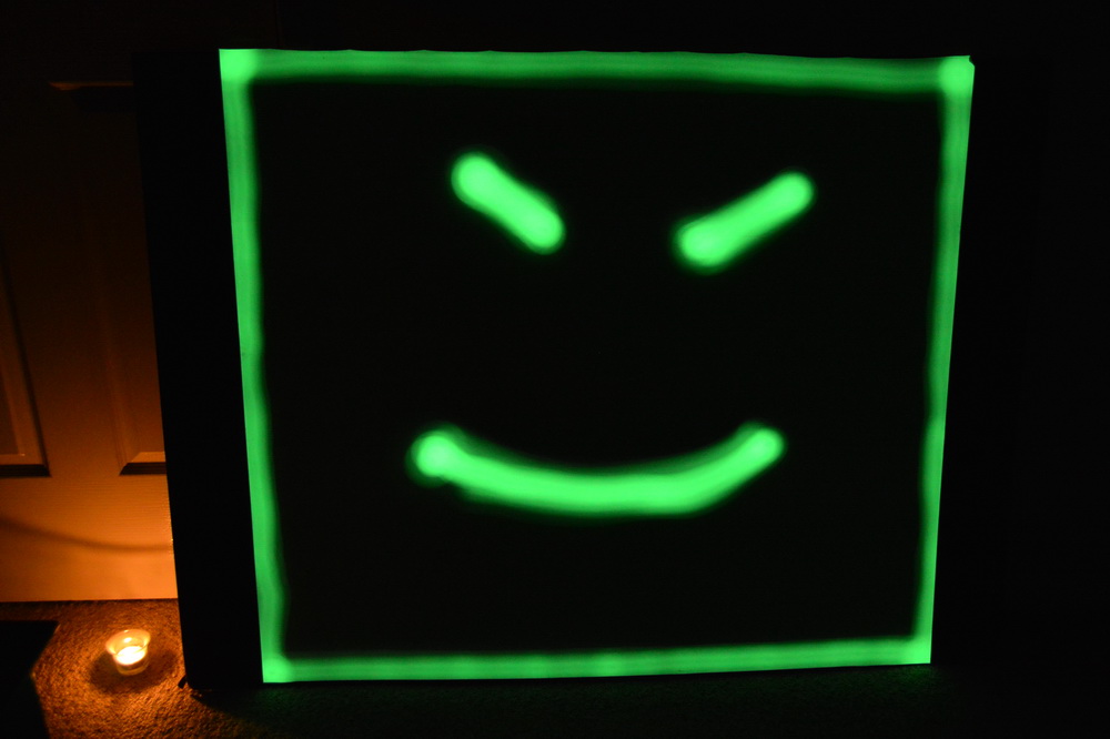 light-painting a phosphorescent sheet with a bright torch